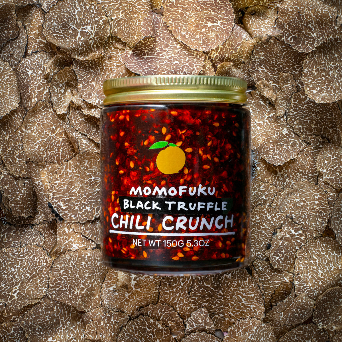 chili crunch jar on a bed of truffles
