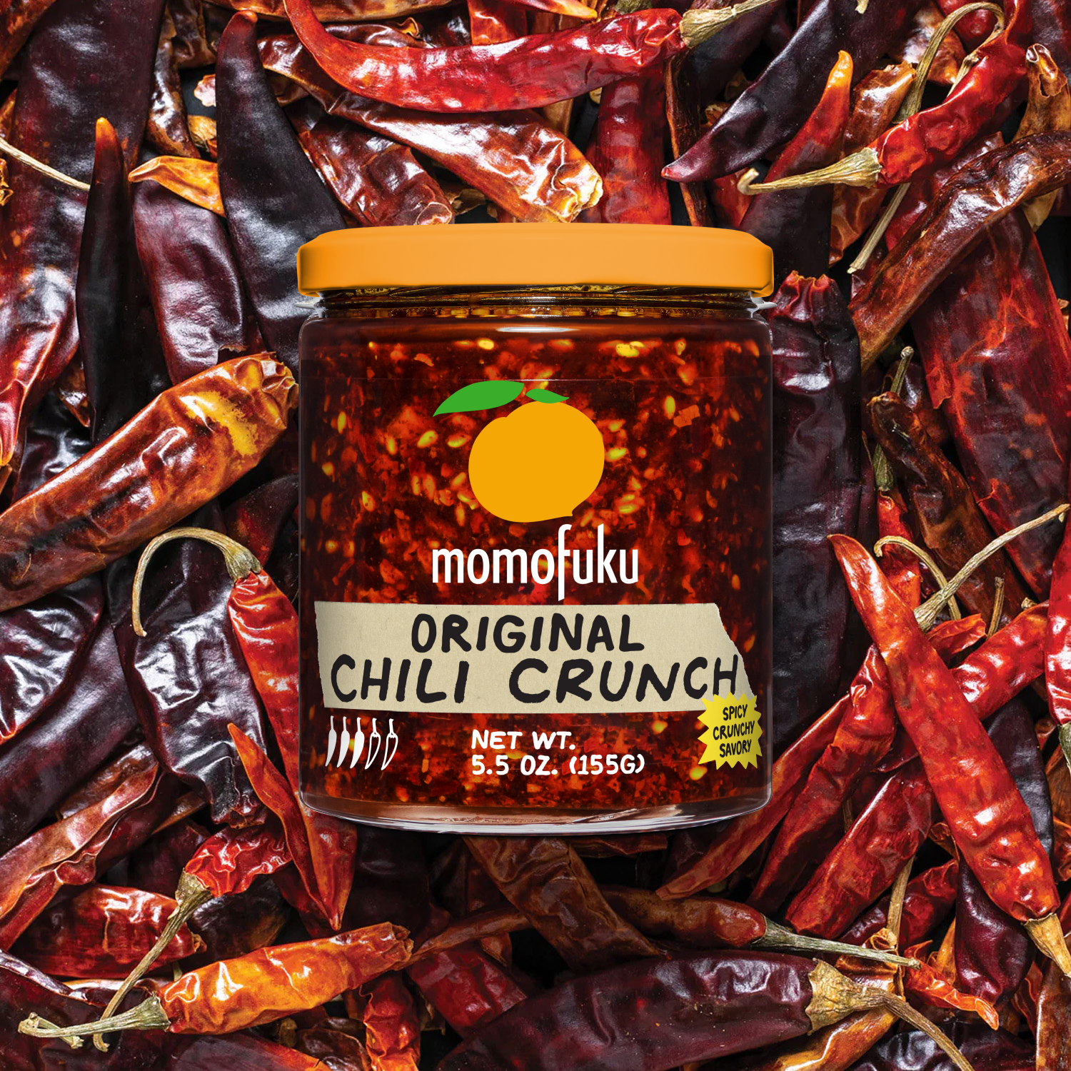 Jar of Chili Crunch on bed of Dried Chilis