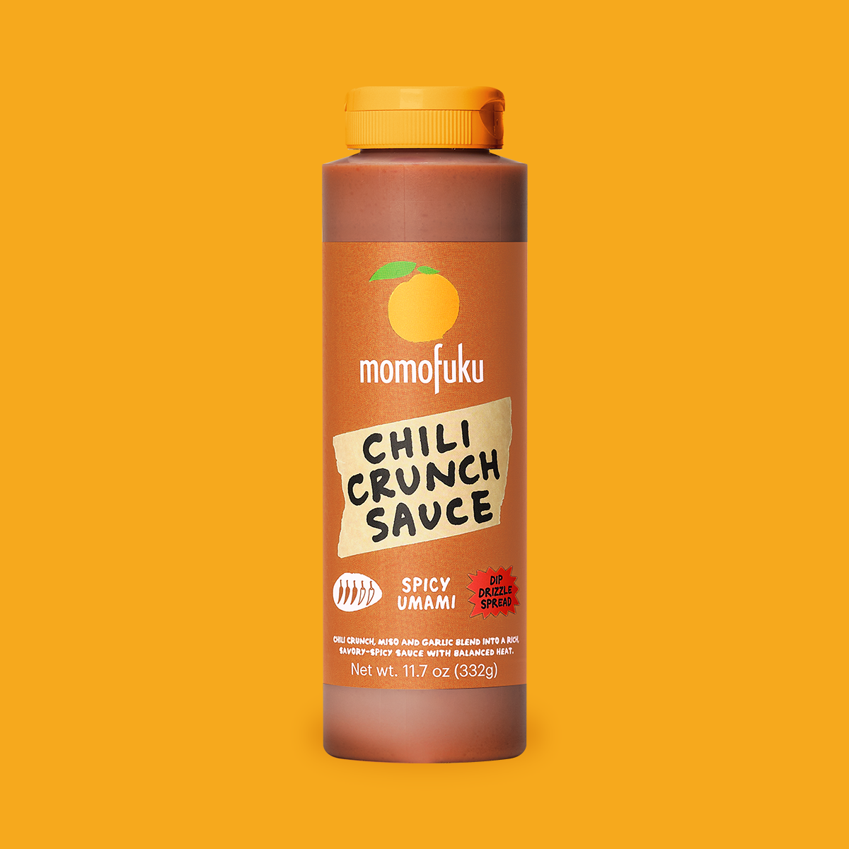 A bottle of Momofuku Chili Crunch Sauce in Spicy Umami flavor, centered on a solid yellow-orange background. The bottle is a warm reddish-brown with a bright orange cap and a matching label featuring a stylized orange graphic.