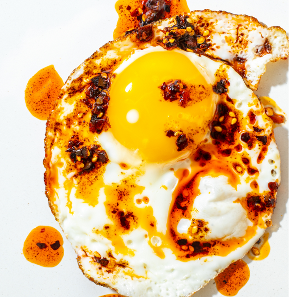 Fried egg with chili sauce