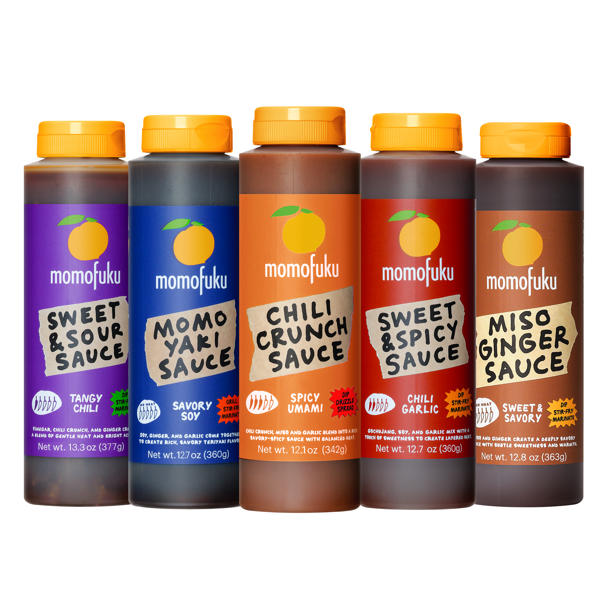 Five bottles of Momofuku sauce lined up on a white background: Tranky Chilli, Savory Soy, Spicy Unami, Sweet & Spicy Garlic, and Sweet & Savory.