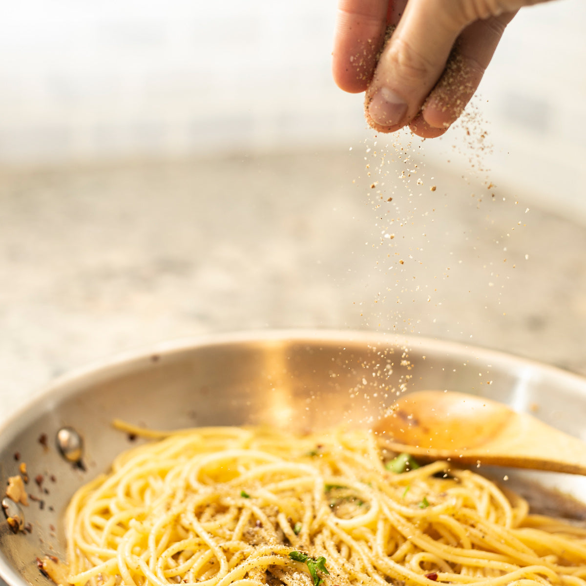 seasoned salt sprinkled on pasta