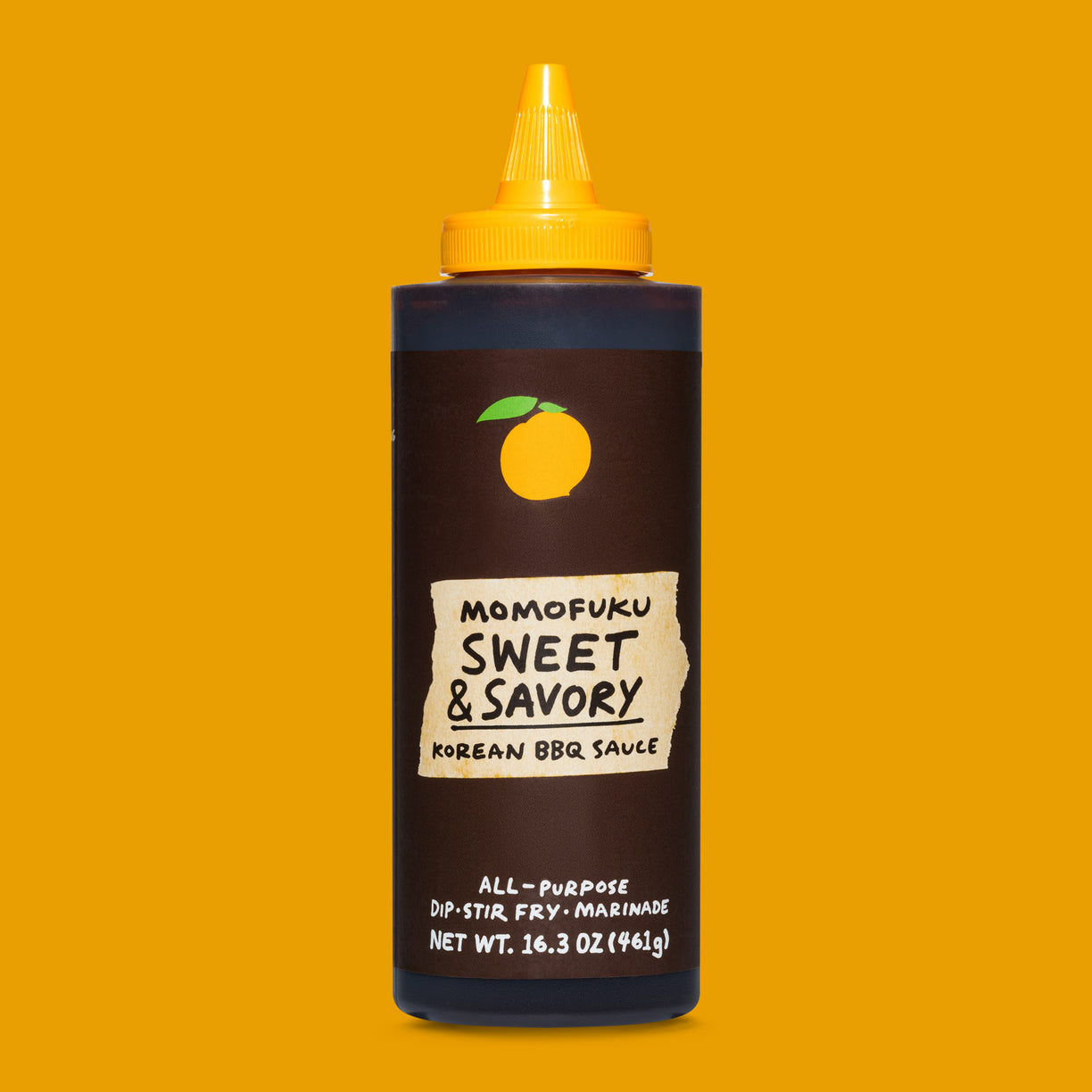 bottle of sweet & savory korean bbq sauce on orange background