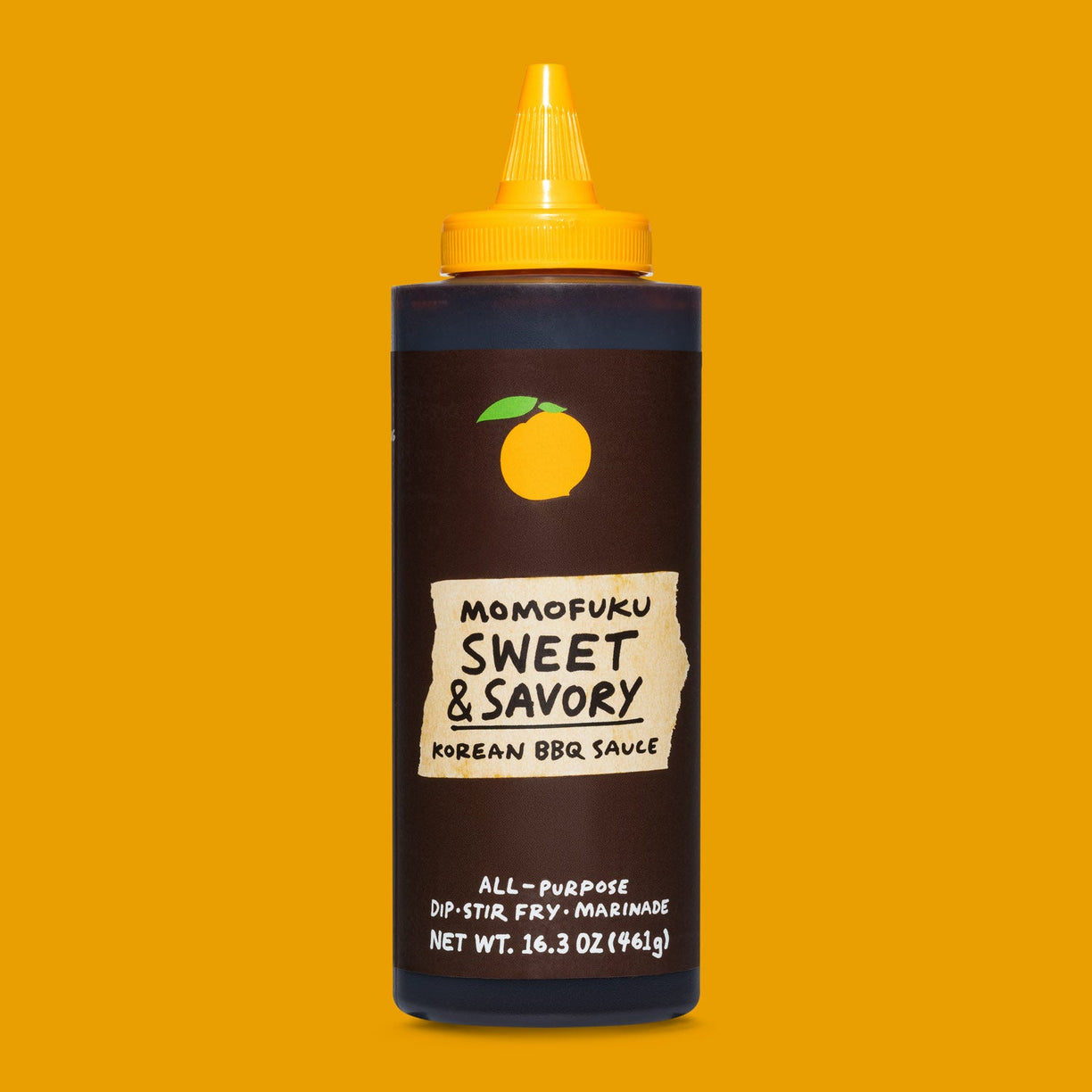 bottle of sweet & savory korean bbq sauce on orange background