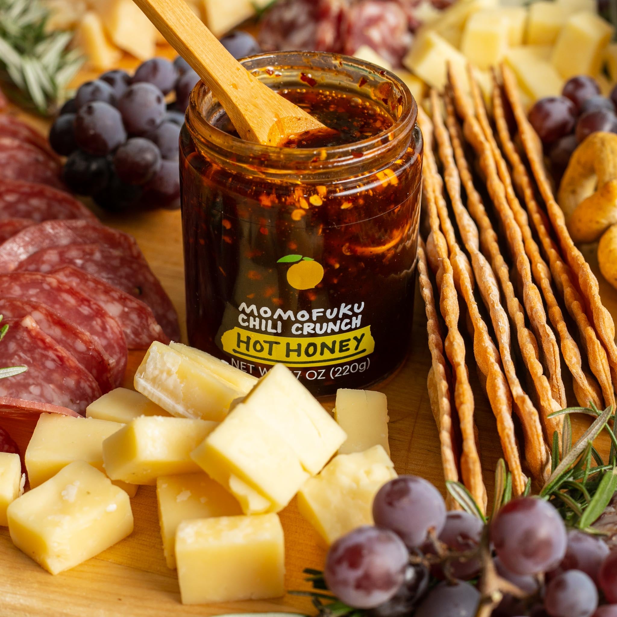 https://shop.momofuku.com/cdn/shop/products/HotHoneyChiliCrunchCheeseboard4_AJB-2.jpg?v=1667775229