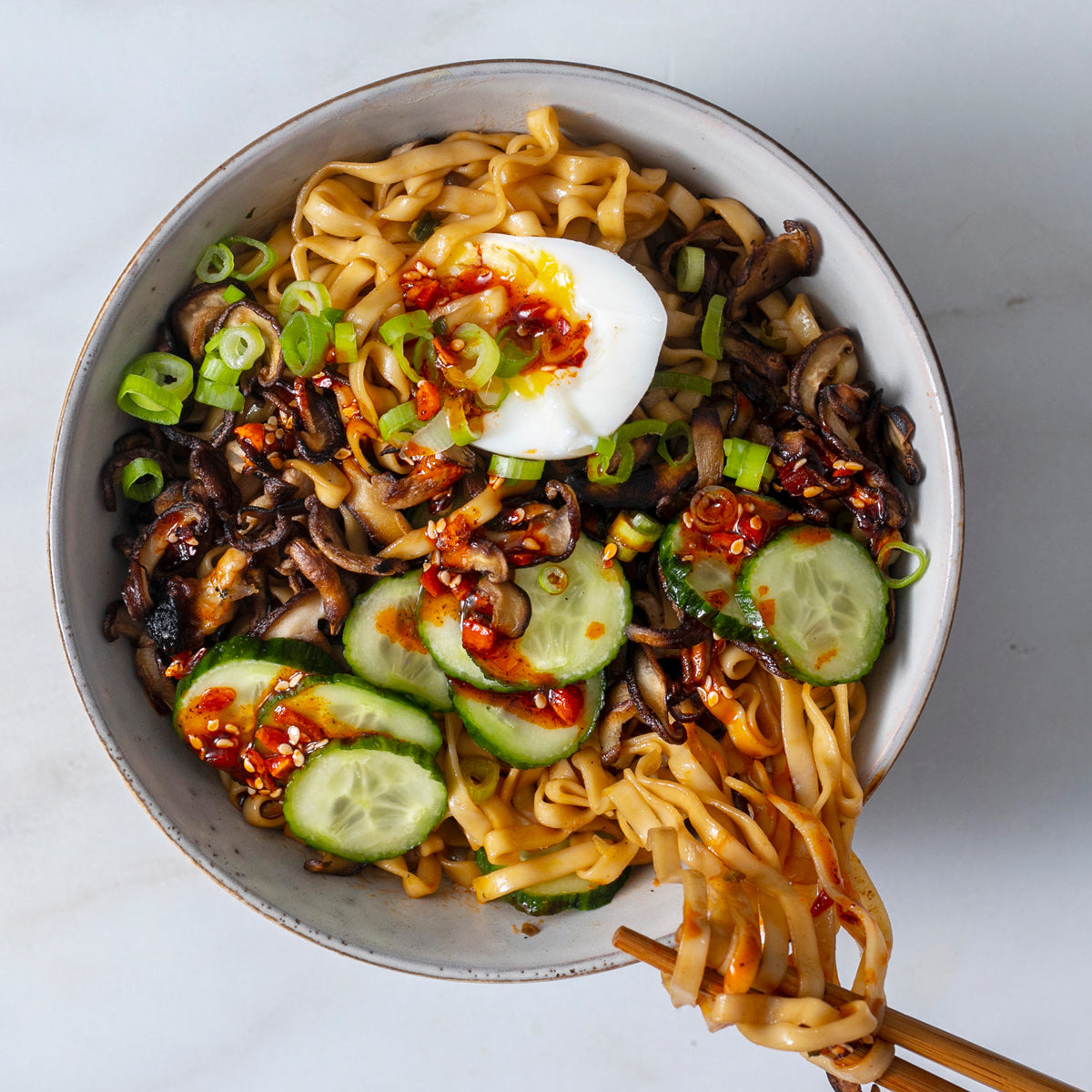 noodles with mushrooms, pickles, and chili crunch